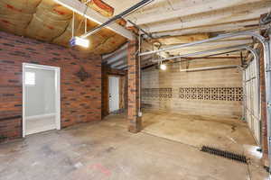 Below grade area featuring brick wall