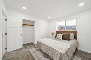 Bedroom featuring carpet, a closet, and recessed lighting