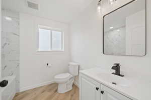 Bathroom featuring vanity and light wood-style flooring
