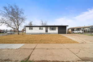 Ranch-style house with concrete driveway, a garage, and brick siding