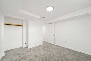 Unfurnished bedroom featuring carpet floors and a closet