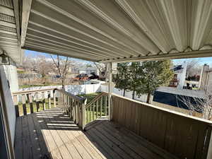 Wooden terrace featuring a residential view