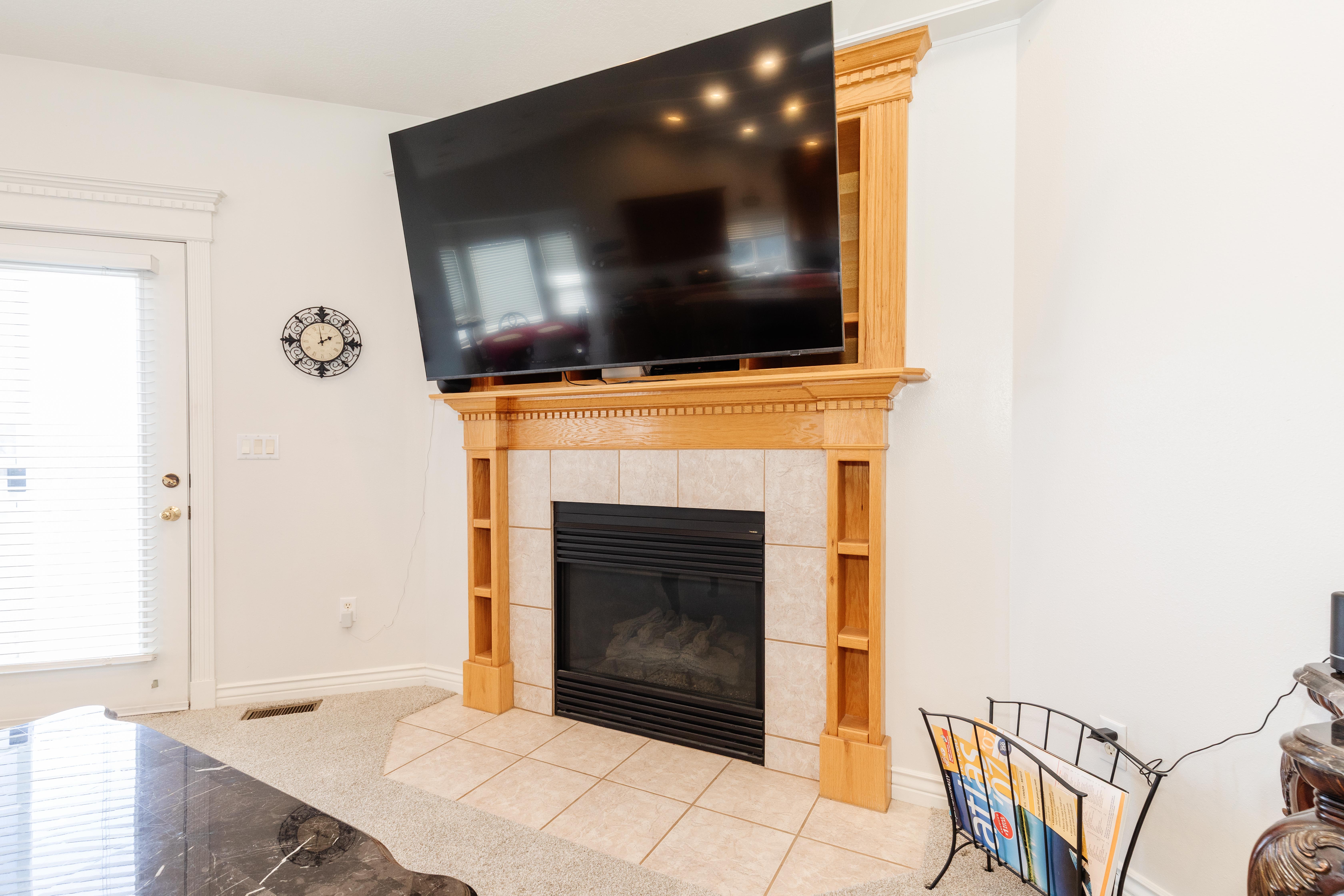 Detailed view of carpet floors and a tile fireplace