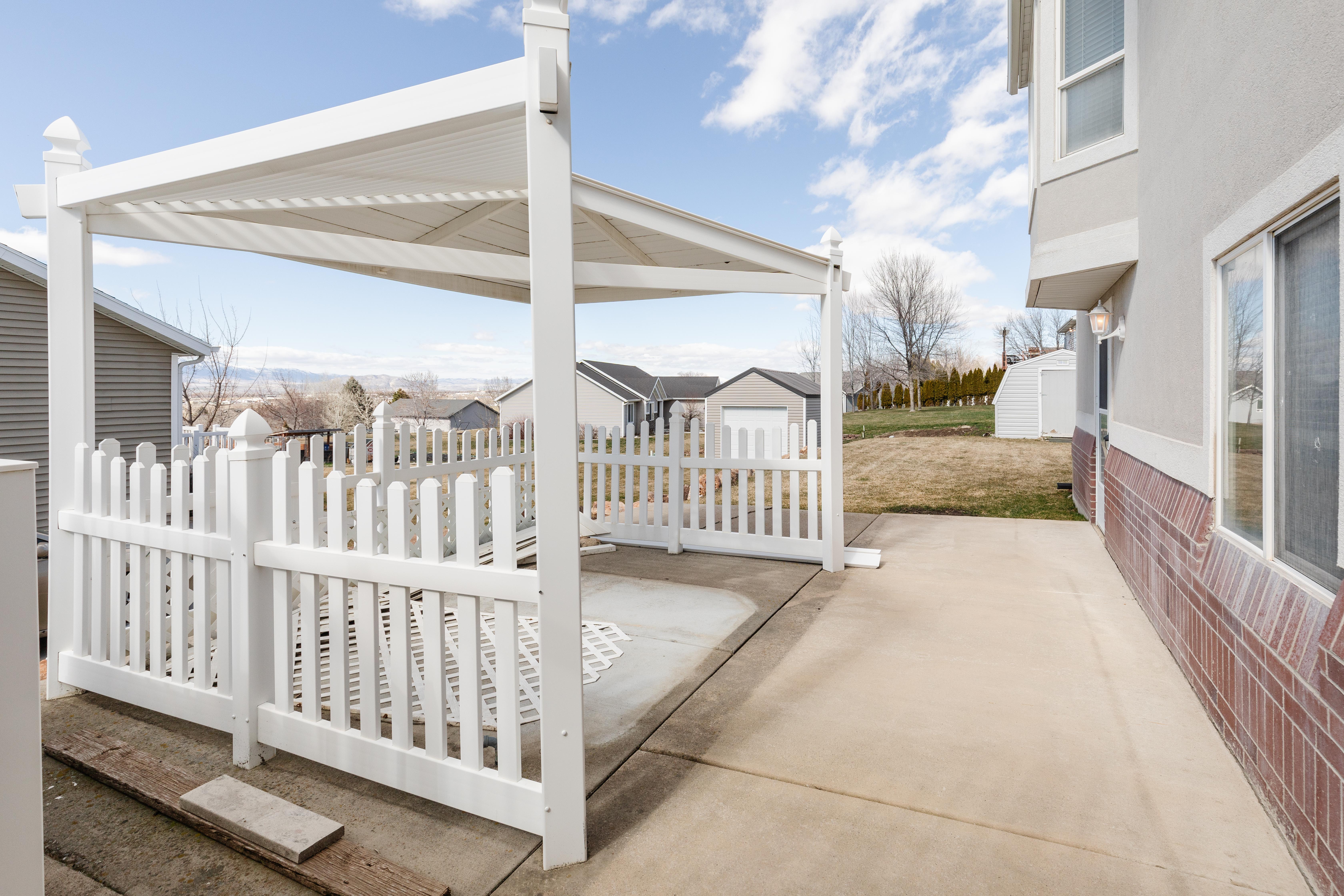 View of patio featuring a shed