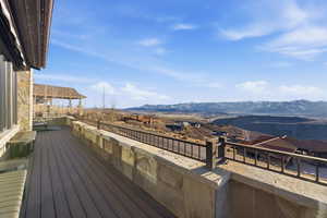 Wooden terrace featuring a mountain view
