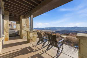 View of patio / terrace with a mountain view