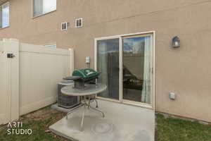 View of patio with a gate