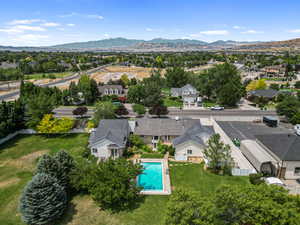 Aerial perspective of suburban area featuring a mountainous background