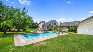 Swimming pool with a patio area and entry steps