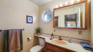 Upstairs bathroom with vanity and toilet