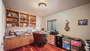 Office space with dark wood-style flooring