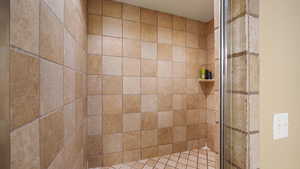 Basement bathroom featuring a shower stall