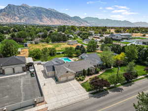Drone / aerial view of a mountainous background and a pool area