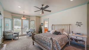 Bedroom featuring access to outside, carpet floors, ornamental molding, ceiling fan, and connected bathroom