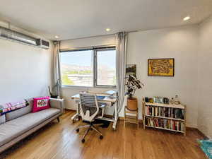 Office featuring a mountain view, wood finished floors, and recessed lighting