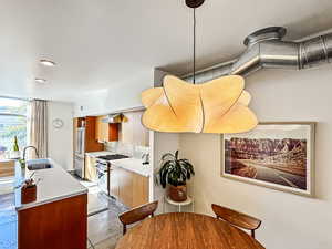 Dining space featuring recessed lighting