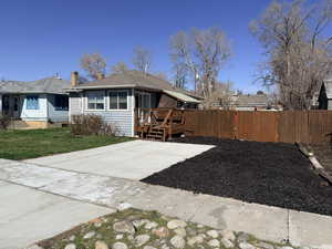 View of front of property featuring a deck and a chimney