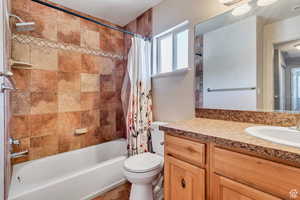 Full bathroom with vanity and shower / bathtub combination with curtain