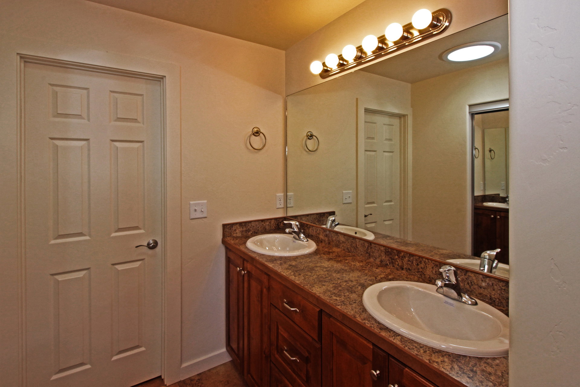Full bath featuring double vanity