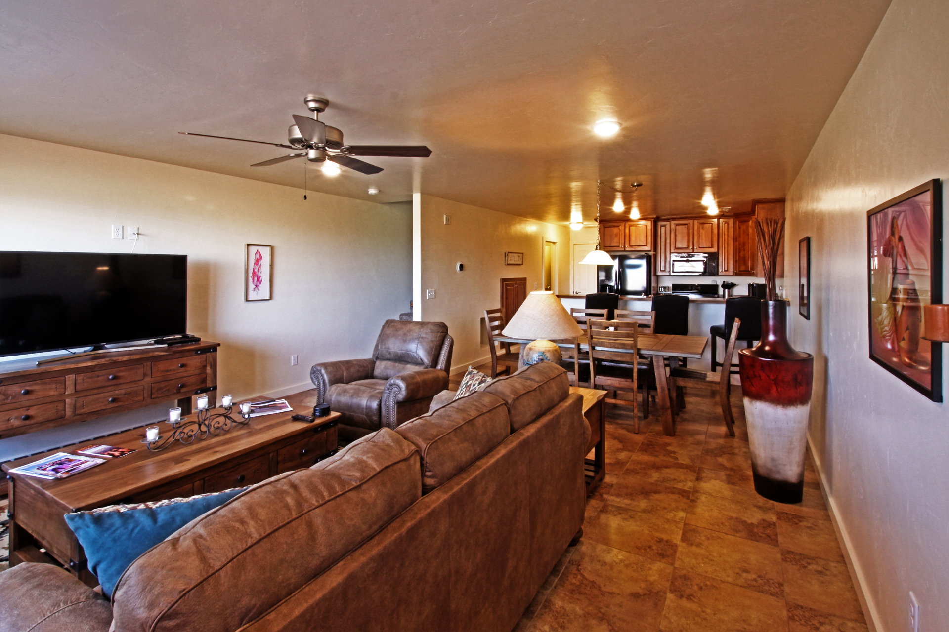 Living room with baseboards and ceiling fan