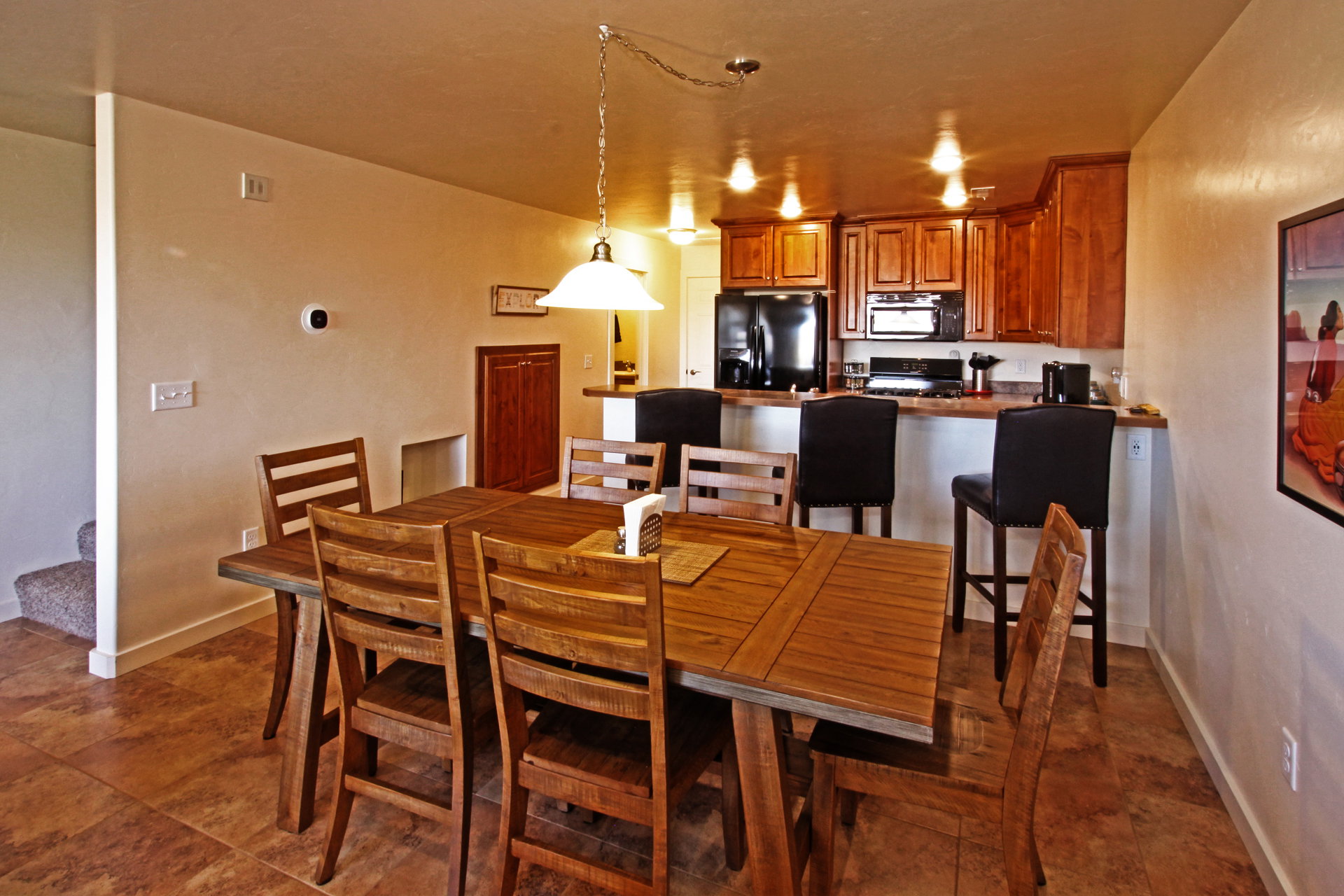 Dining space with stairs and baseboards