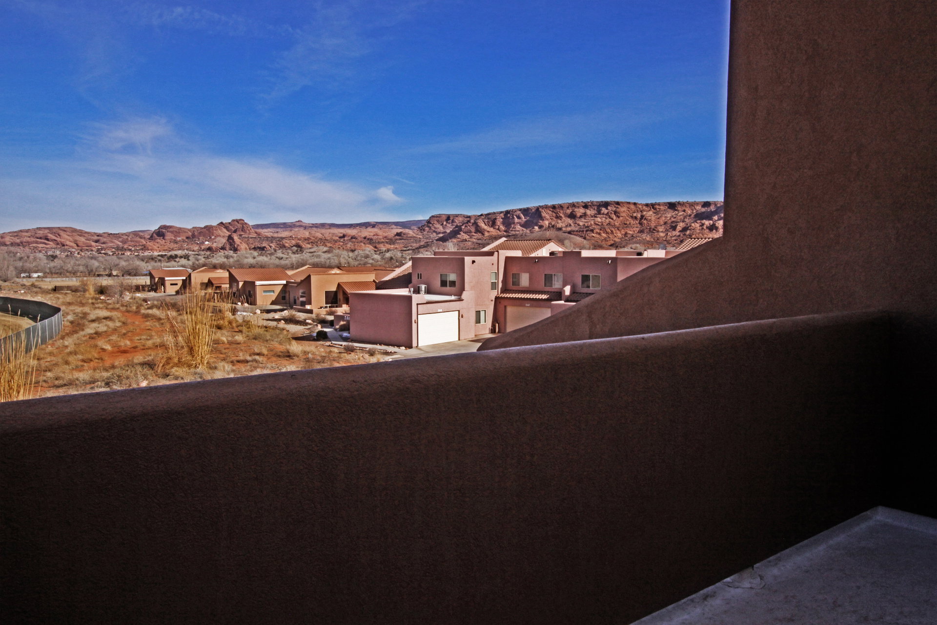 Balcony featuring a mountain view and a residential view
