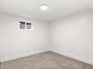 Bedroom #3 with baseboards and light colored carpet