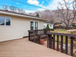 Wooden deck with french doors and a mountain view