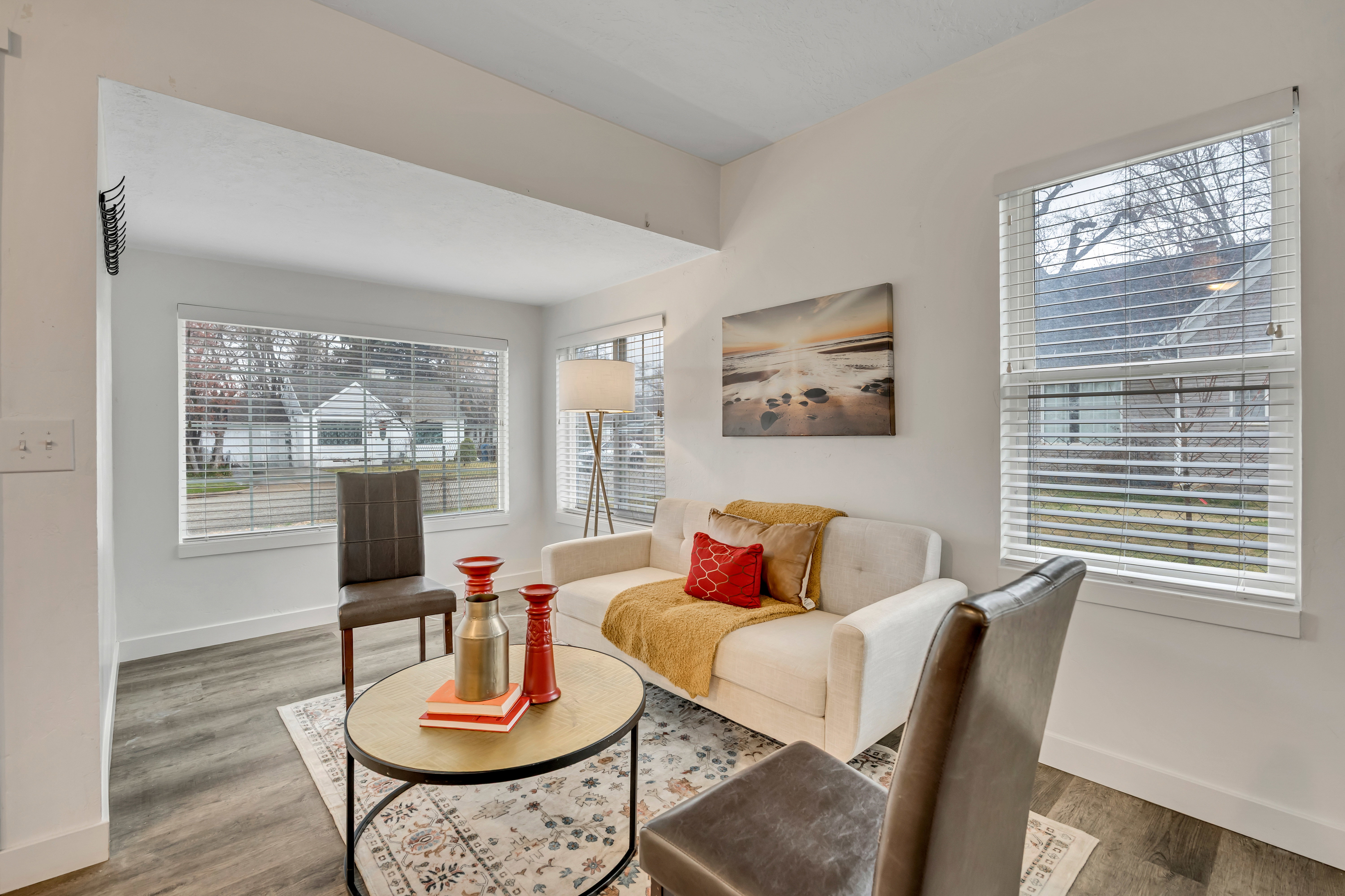 Living area featuring baseboards and wood finished floors