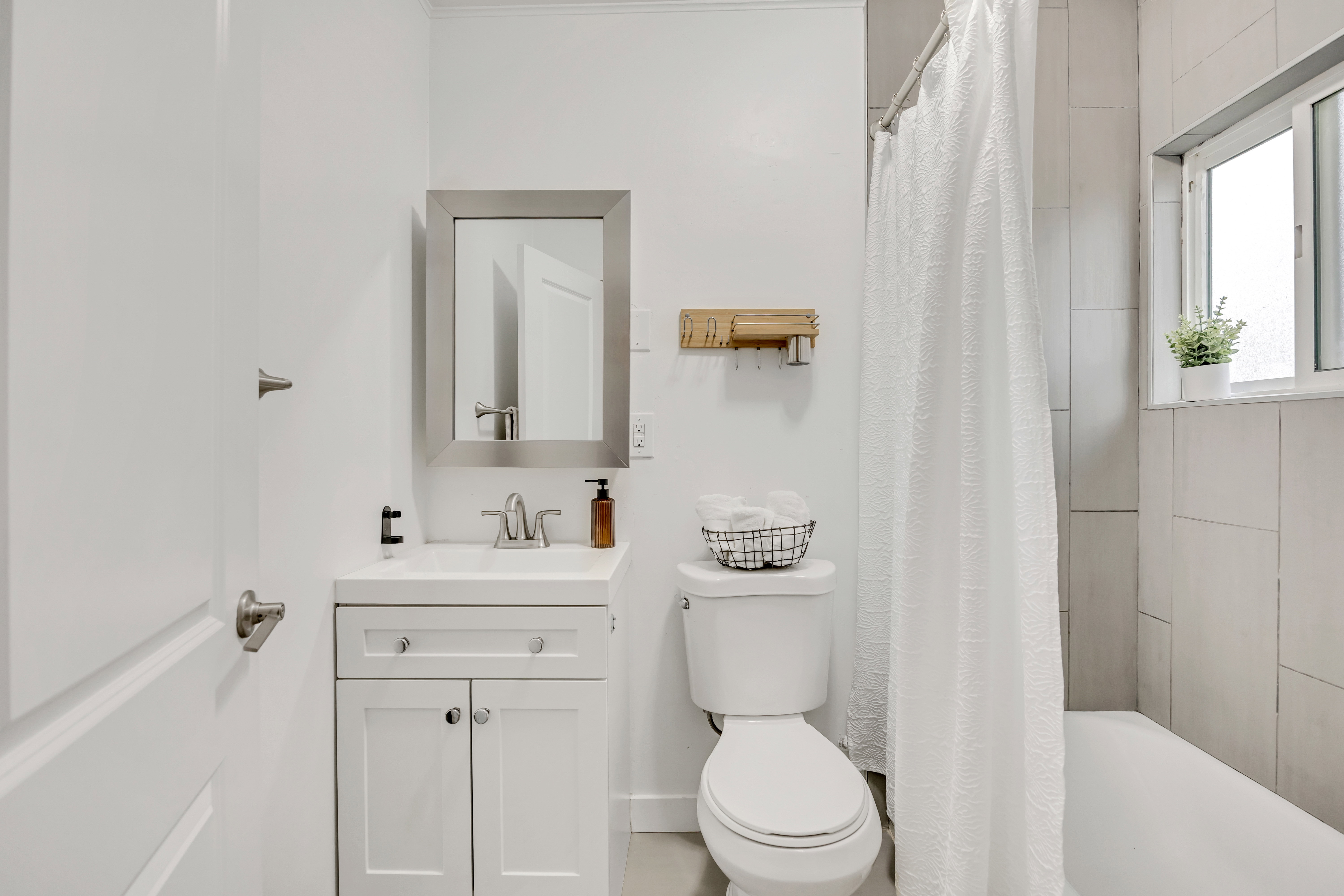 Bathroom with vanity and shower / bath combo