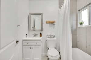 Bathroom with vanity and shower / bath combo