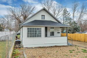 View of front of property featuring a shingled roof