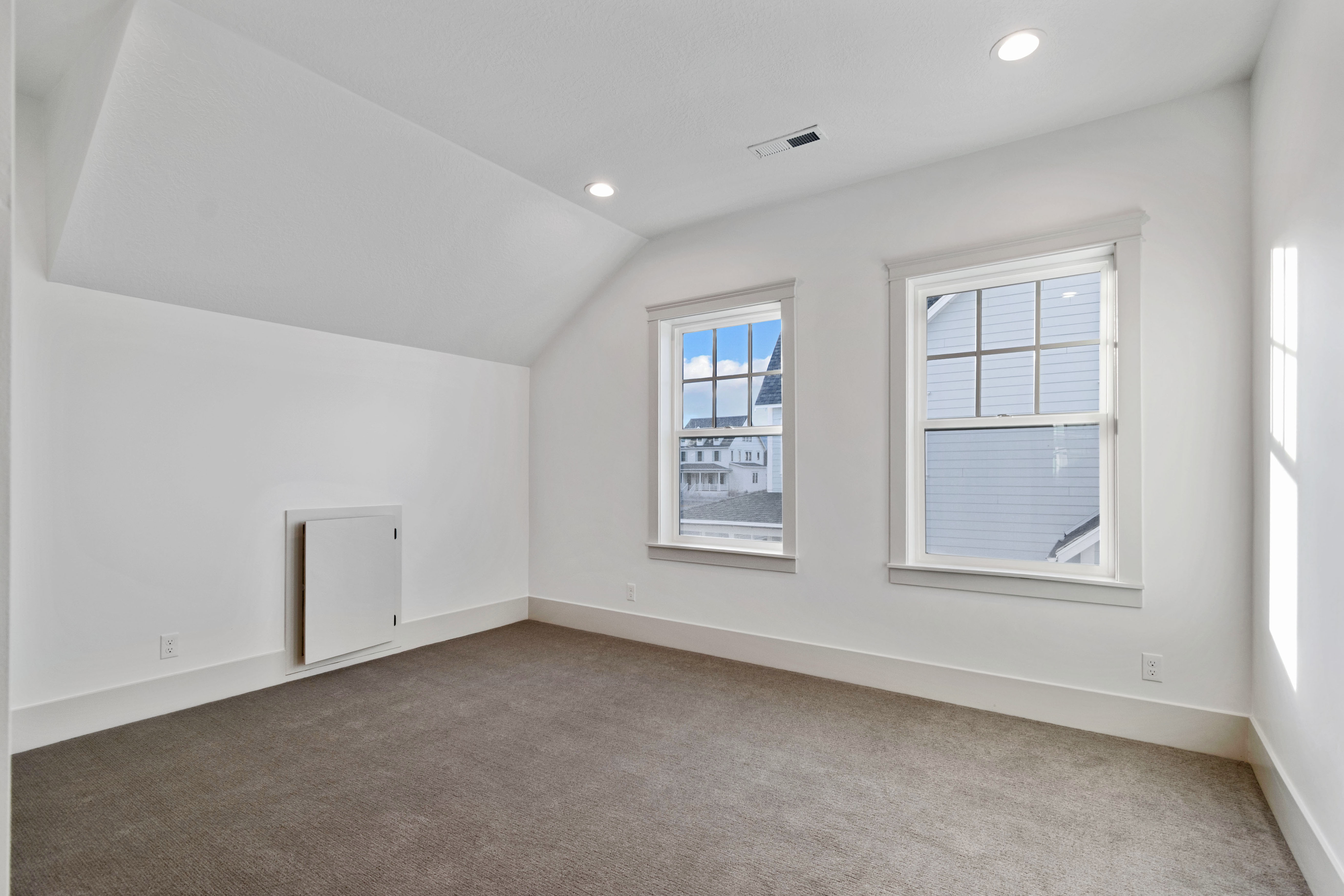 Additional living space featuring carpet flooring, vaulted ceiling, and recessed lighting