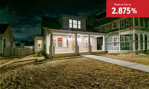 Exterior entry at twilight with a porch