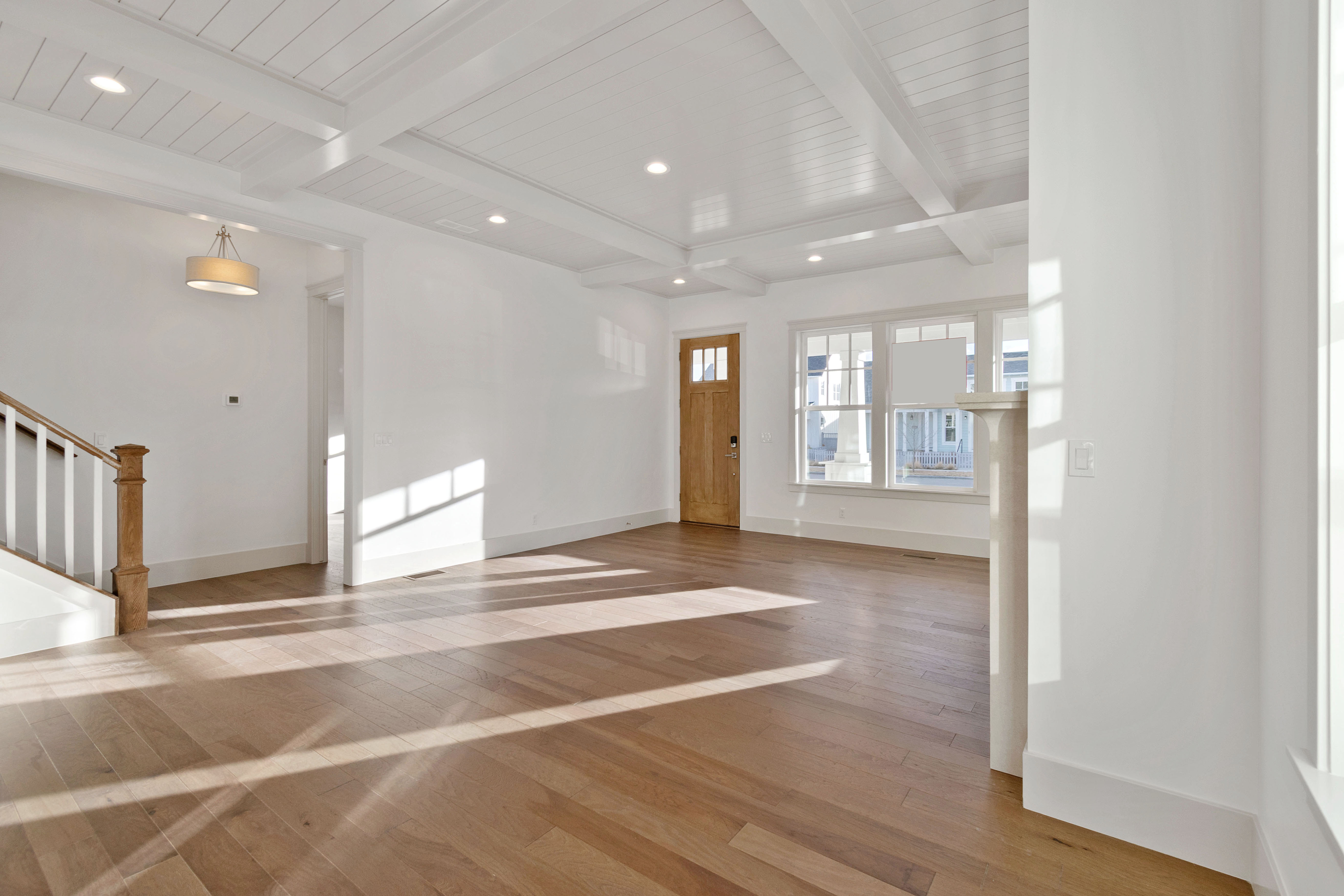 Entryway featuring recessed lighting, light wood finished floors, and beam ceiling