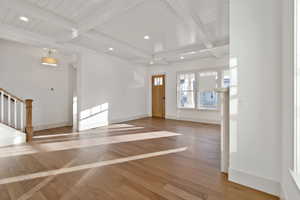 Entryway featuring recessed lighting, light wood finished floors, and beam ceiling