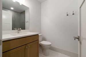 Bathroom with vanity and light tile patterned floors