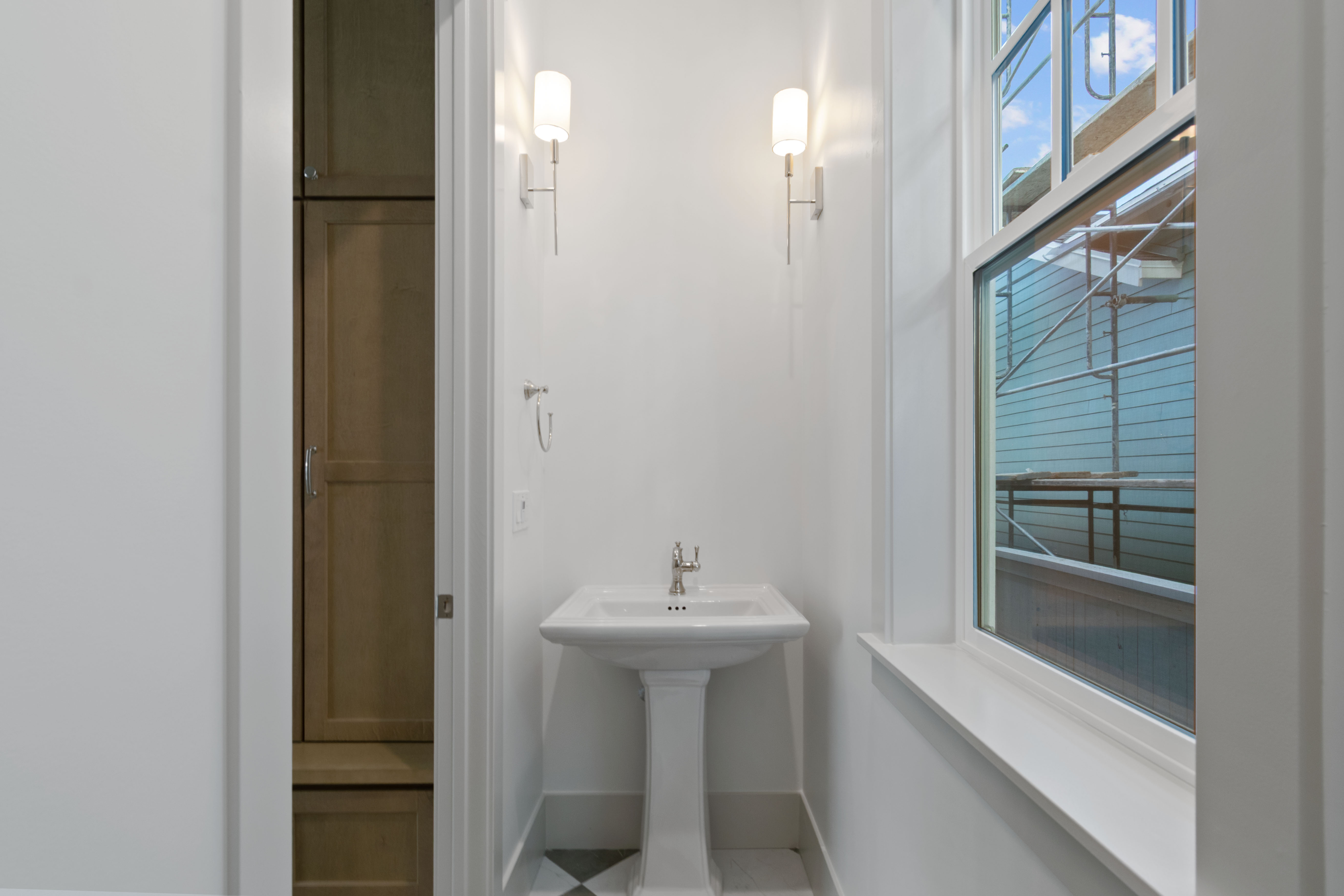 Bathroom with baseboards and tile patterned flooring