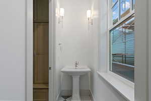 Bathroom with baseboards and tile patterned flooring