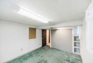 Finished below grade area featuring carpet flooring