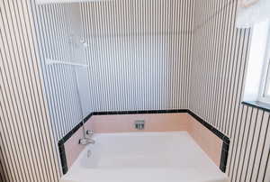 Full bathroom with a bath