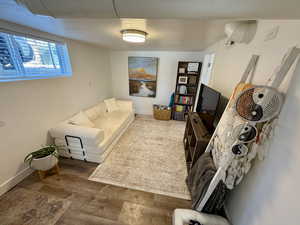 Living area featuring wood finished floors and baseboards
