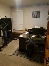 Home office with light carpet