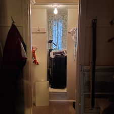 Bathroom with dark carpet and baseboards