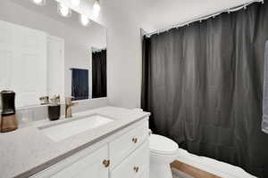 Bathroom with vanity and toilet