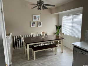 Dining area featuring light wood-style flooring and a ceiling fan