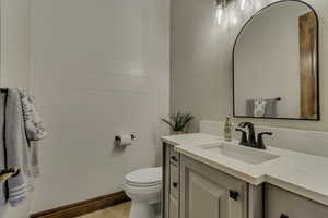Half bath with vanity and toilet