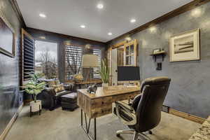 Office area with carpet flooring, crown molding, and recessed lighting