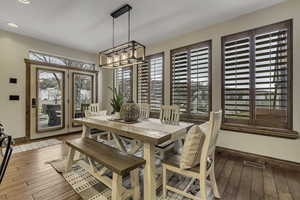 Dining space featuring hardwood / wood-style floors and baseboards