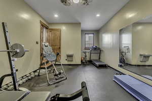 Exercise area featuring recessed lighting